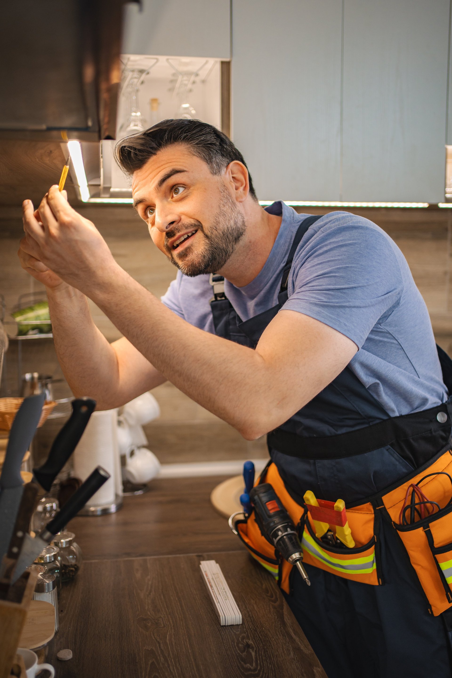 Professional electrician working on led lights installation